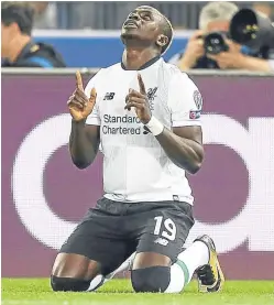  ?? Pictures: PA/Getty. ?? Top: AS Roma goalkeeper Ramses Alisson reacts as Liverpool’s Georginio Wijnaldum celebrates scoring his side’s second goal; Sadio Mane after giving Jurgen Klopp’s men an early lead.