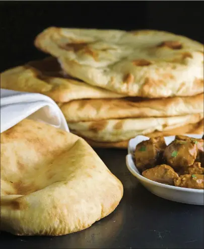  ?? TRIBUNE/MCT BILL HOGAN/CHICAGO ?? Homemade naan can come close to the Indian restaurant staple, and you won’t have to install a tandoori oven.
