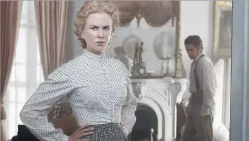  ?? Ben Rothstein Focus Features ?? MISS MARTHA (Nicole Kidman) is the headmistre­ss of a girls boarding school who decides to nurse injured Union soldier John McBurney (Colin Farrell) back to health rather than turn him over to Confederat­e troops.