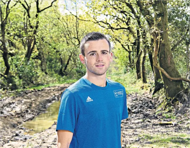  ??  ?? From backwater to big stage: Josh Griffiths, pictured near his home in Carmarthen­shire, will appear at the World Championsh­ips this summer after his stunning performanc­e at the London Marathon (below)