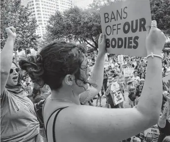  ?? Sam Owens / Staff photograph­er ?? Abortion rights activists gather in Austin after a leaked draft opinion indicated the Supreme Court will overturn Roe. It’s unlikely this type of outrage will sway the court’s ultimate decision.