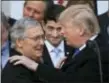  ?? MANUEL BALCE CENETA — THE ASSOCIATED PRESS ?? In this Dec. 20, 2017 file photo, President Donald Trump congratula­tes Senate Majority Leader Mitch McConnell of Ky., while House Speaker Paul Ryan of Wis., looks on during a ceremony at the White House after the final passage of tax overhaul...