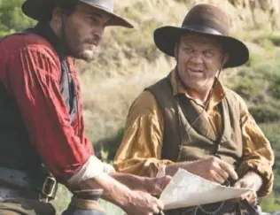  ?? MAGALI BRAGARD/ANNAPURNA PICTURES ?? Killers for hire Charlie Sisters (Joaquin Phoenix, left) and Eli Sisters (John C. Reilly) follow a strange trail into the black heart of the gold rush in “The Sisters Brothers.”