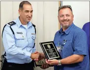  ?? Contribute­d ?? Maj. Rodney Bailey presents a plaque from the Rome Police Department to Lt. Col. Amit Pollak, Chief of the Haifa Police, Israel for Brigadier General Benni Abalia, Commander of Asher Sub District of the Israeli Police.