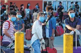  ??  ?? MIGRANT LABOURERS waiting to board a special Shramik train to Manipur from MGR Central railway station in Chennai