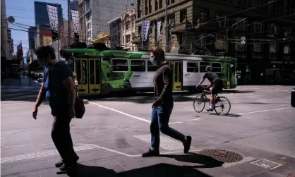  ?? Photograph: Luis Ascui/AAP ?? People on the street in Melbourne’s CBD. The IMF does not expect Australia’s unemployme­nt rate to be comfortabl­y below 6% until next year, forecastin­g a rate of 5.5% in 2022.