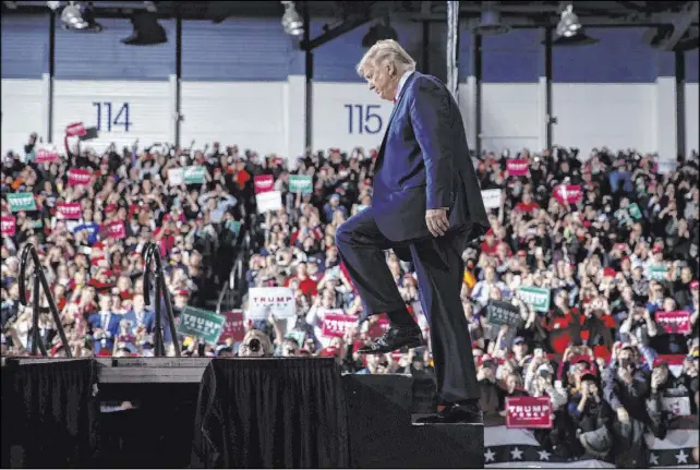  ?? Evan Vucci The Associated Press ?? President Donald Trump arrives at W.K. Kellogg Airport to attend a campaign rally on Dec. 18 in Battle Creek, Mich., the day he was impeached.