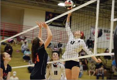  ?? OWEN MCCUE - MEDIANEWS GROUP FILE ?? Boyertown’s Emma Ludwig, right, hits the ball over the net as Perkiomen Valley’s Ella Beckman prepares to leap and block.