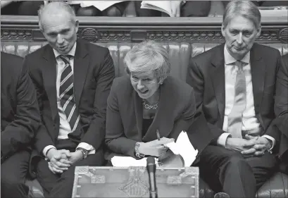  ?? MARK DUFFY, UK PARLIAMENT VIA AP ?? Britain’s Prime Minister Theresa May reacts during a debate before a noconfiden­ce vote raised by opposition Labour Party leader Jeremy Corbyn in the House of Commons in London on Wednesday. Prime Minister May won the no-confidence vote.