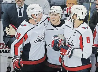  ?? COLUMBUS DISPATCH FILE PHOTO ?? Washington Capitals’ Nicklas Backstrom, T.J. Oshie and Alex Ovechkin celebrate a 4-1 playoff win against the Blue Jackets on April 19. Backstrom is questionab­le for Game 1 of the Eastern final against Tampa Bay.