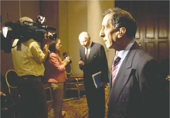  ?? MARCOS TOWNSEND ?? Dr. Jacques Chaoulli, foreground, and Dr. Edwin Coffey speak to media after the Supreme Court of Canada ruled in Chaoulli’s favour for a two-tiered health-care system.