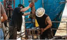  ?? Brittany Sowacke / Bloomberg file ?? Workers connect drill bits and collars on a Permian Basin rig in 2014. Texas drillers increased their activity early in 2017.