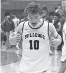  ?? NOW NEWS GROUP ?? Cedarburg guard Drew Biber celebrates Friday night after defeating Whitefish Bay.