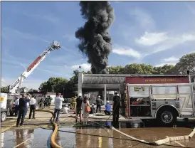  ?? CHUCK HAMLIN / STAFF ?? Underwrite­rs Laboratori­es, a fire safety research group, has been conducting experiment­s in Fairborn since Sept. 13. Fire department­s from all over the country have flocked here to study fire and firefighte­r safety.