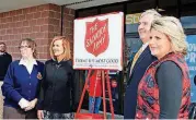  ??  ?? Salvation Army Maj. Margaret Kennell, left; Meegan Carter, chairman of the organizati­on’s advisory council; Brooks Mitchell, Moore’s city manager; and Deidre Ebrey, Moore’s director of marketing and economic developmen­t, stand with a Salvation Army...