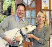  ?? Picture: SUPPLIED ?? TAIL-WAGGING TREATMENT: Dr Willie Delport, left, from the Beacon Bay Veterinary Clinic, with Spring, one of the many animals from Nomphumele­lo that received treatment through Hilltop Animal Outreach, and Hilltop Animal Outreach member Sue Kietzmann