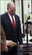  ?? MARC LEVY — AP ?? Democratic U.S. Sen. Bob Casey of Pennsylvan­ia inspects equipment on the shop floor at Tooling Dynamics during a tour of the company where he touted legislatio­n he helped write to emphasize vocational skills training for high-demand industrial-sector jobs, Monday In York, Pa.