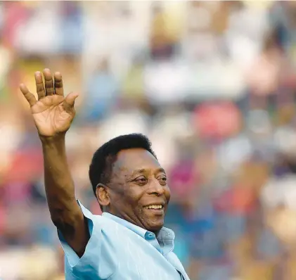  ?? MONEY SHARMA/GETTY- AFP ?? Brazilian soccer star Pele greets the crowd before the start of a 2015 game. Pele died Dec. 29 after battling colon cancer.