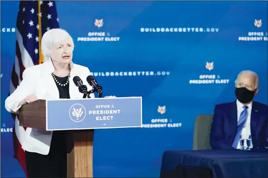  ??  ?? President-elect Joe Biden, (right), listens as Janet Yellen, who Biden nominated to serve as Secretary of the Treasury, speaks at The Queen Theater, on Dec 1, 2020, in Wilmington, Delaware. (AP)