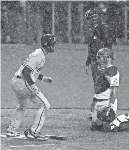  ?? SAM GREENE VIA IMAGN CONTENT SERVICES, LLC ?? The Diamondbac­ks’ Pavin Smith scores the go-ahead run in the eighth inning against the Reds on Tuesday night. The game was suspended after a rain delay and with Arizona leading 5-4.