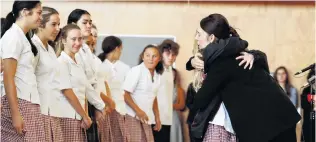  ?? PHOTO: REUTERS ?? A leader’s embrace . . . Prime Minister Jacinda Ardern hugs a pupil during her visit to Cashmere High School, in Christchur­ch, yesterday.