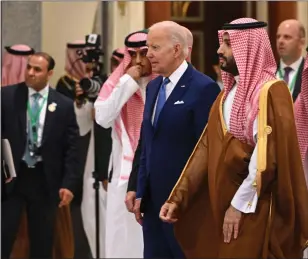  ?? MANDEL NGAN — GETTY IMAGES/TNS ?? President Joe Biden, center left, and Saudi Crown Prince Mohammed bin Salman, center right, arrive for a family photo during the Jeddah Security and Developmen­t Summit (GCC+3) at a hotel in Saudi Arabia’s Red Sea coastal city of Jeddah on July 16.