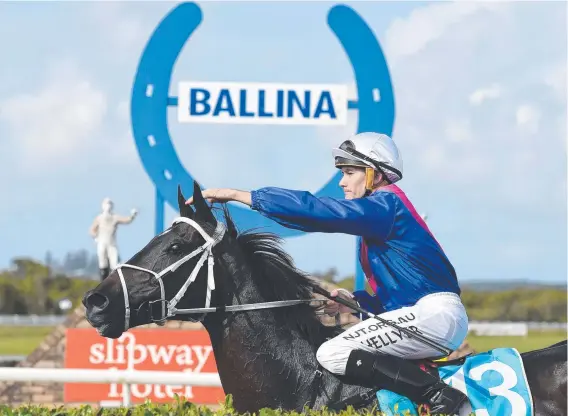  ?? Picture: Marc Stapelberg ?? Jockey Michael Hellyer gives Melted Moments a pat after riding the horse to victory in the 2020 Ballina Cup.