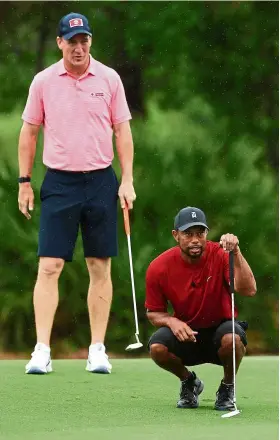  ??  ?? Tiger Woods and two-time NFL Super Bowl winner Peyton Manning en route to winning the charity match at the Medalist Golf Club.