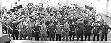  ??  ?? DCP Hazani (front row, sixth from left) with his men after the monthly assembly.