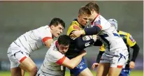  ??  ?? Triple teamed: Gareth Anscombe is tackled by Cameron Neild, AJ MacGinty and Ben Curry