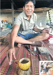  ??  ?? Uthai Kumram, 60, shows a coffee mug made from a coconut shell. As a farmer, he makes a living only once a year and decided to put his skills to the test after the village began drawing tourists. First, he started carving birds from coconut shells and...