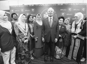  ??  ?? Najib and Rosmah (third right) attend the opening of the Internatio­nal Conference on Women in Politics 2017. Also seen are Shahrizat (on Najib’s right) and Rohani (second right). — Bernama photo