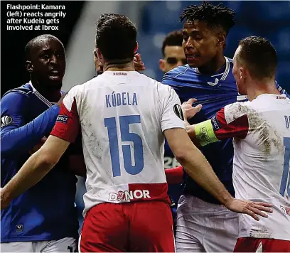  ??  ?? Flashpoint: Kamara (left) reacts angrily after Kudela gets involved at Ibrox