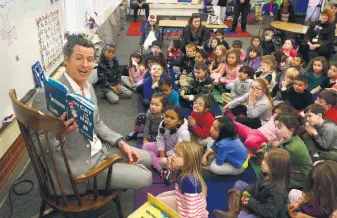  ?? Rich Pedroncell­i / Associated Press 2015 ?? Lt. Gov. Gavin Newsom reads to kindergart­ners at Sierra Oaks school in Sacramento in 2015. The state’s teachers unions are supporting Newsom’s candidacy in this year’s governor’s race.