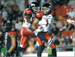  ?? THE CANADIAN PRESS/JUSTIN TANG ?? Calgary Stampeders Lemar Durant (1) celebrates his touchdown with Kamar Jorden (88) as Ottawa Redblacks Loucheiz Purifoy (5) walks off, during second half CFL action in Ottawa on Thursday.
