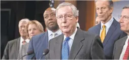  ?? MICHAEL REYNOLDS/EPA-EFE ?? Senate Majority Leader Mitch McConnell, center, is hoping for bipartisan work in 2018 on immigratio­n and infrastruc­ture.