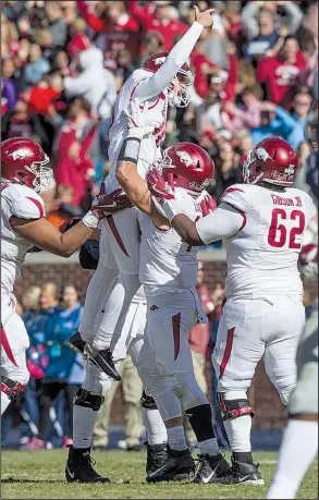  ?? NWA Democrat-Gazette/BEN GOFF ?? Arkansas kicker Connor Limpert (center) celebrates after kicking the game-winning field goal at Ole Miss last season. He has performed well in preseason camp. “I haven’t missed inside the 40 and that’s going to be my goal [for the season],” Limpert said. “My goal, honestly, is to never miss.”