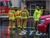  ?? Austin Dave/The Signal (See additional photos at signalscv.com) ?? An emergency response crew stands outside of Stevenson Ranch Library after a white powder was discovered on the property. The powder turned out to be a cleaning product, an official said.