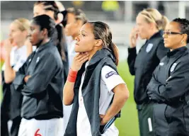  ?? ?? Pain game: Alex Scott (below centre) looks on after England lose 6-2 to Germany in the final of Euro 2009 in Helsinki