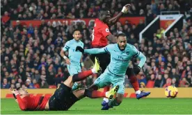  ?? Images Photograph: Simon Stacpoole/Offside/Getty ?? Alexandre Lacazette scores Arsenal’s second goal in a draw at Manchester United that leftJosé Mourinho’s team 18 points off the top of the Premier League.