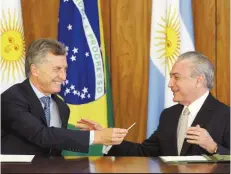  ?? | ANTONIO CRUZ/AGÊNCIA BRASIL ?? Macri e Temer assinaram uma série de memorandos