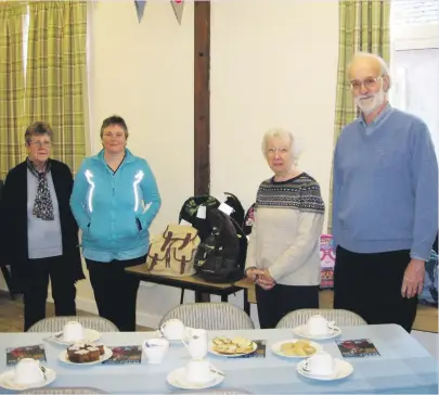  ??  ?? Members of the Craft and Company group of Nether Lochaber and the 10 backpacks handed over.