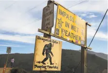  ??  ?? A sign at Bixby Creek Bridge cautions tourists to not drop waste — that kind of waste — which locals object to.