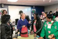  ?? AP Photo/Andrew DeMillo ?? ■ Former New York City Mayor and presidenti­al candidate Michael Bloomberg talks to volunteers assembling backpacks at Scholarmad­e Achievemen­t Place on Jan. 20 in Little Rock.