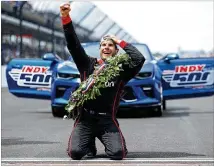  ?? PATRICK SMITH / GETTY IMAGES ?? Australian Will Power celebrates Sunday after winning the Indianapol­is 500 and kissing the bricks on a day that saw many of IndyCar’s top drivers make costly mistakes.