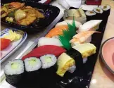  ??  ?? Photo provided by Paektu Cultural Exchange, a sushi set is displayed on a table at the restaurant of Japanese sushi chef Kenji Fujimoto in Pyongyang, North Korea. — AP