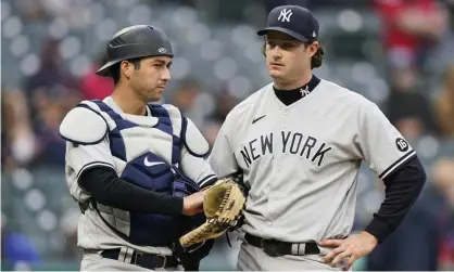  ?? Photograph: Tony Dejak/AP ?? Yankees pitcher Gerrit Cole, right, talks with catcher Kyle Higashioka. Cole has been asked about his use of foreign substances.