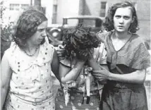  ??  ?? Mrs. Rudolph Gold, center, the mother of Vivian Gold, leaves an Ann Arbor, Michigan, hospital where she had to identify the body of her daughter, circa Aug. 13, 1931. Assisting Gold are sister Margaret Mathies, left, and Mrs. Carl Lore, sister-in-law of Harry Lore, Vivian’s cousin and one of the boys killed.