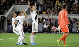  ??  ?? Zlatan Ibrahimovi­ć celebrates after scoring against Los Angeles FC in August. Photograph: Marcio José Sánchez/AP