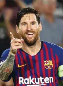  ?? – Reuters ?? TOP SCORER: Barcelona’s Lionel Messi celebrates scoring their fourth goal to complete his hat-trick.